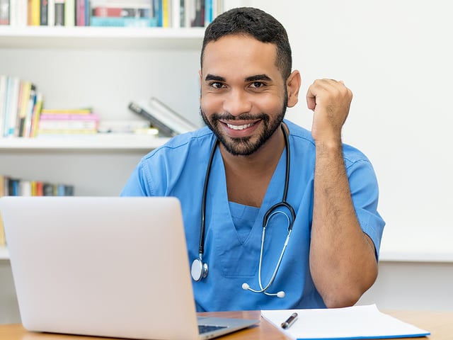 male nurse behind computer.jpg