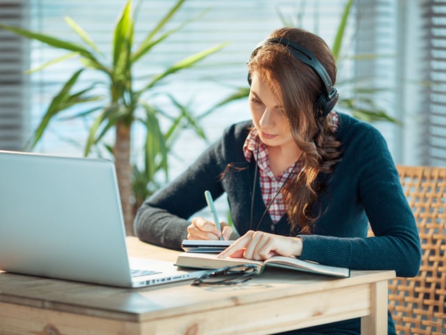 woman studying book computer.jpg