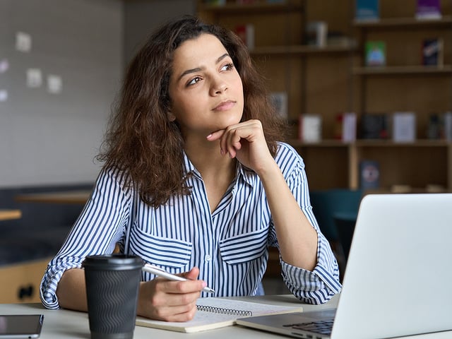 woman thinking by computer.jpg