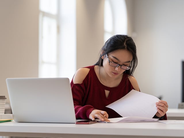 colllege student with glasses computer.jpg