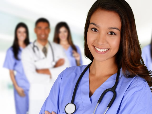 smiling nurse in foreground.jpg