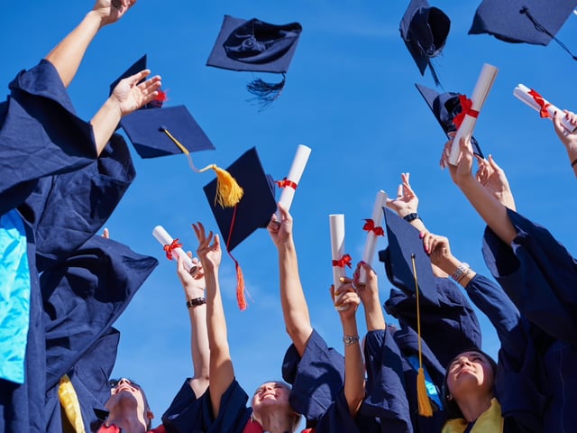 graduates throwing caps.jpg