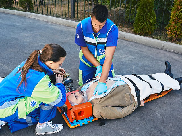 2 paramedics with patient.jpg