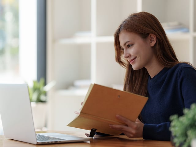 woman studying book laptop.jpg