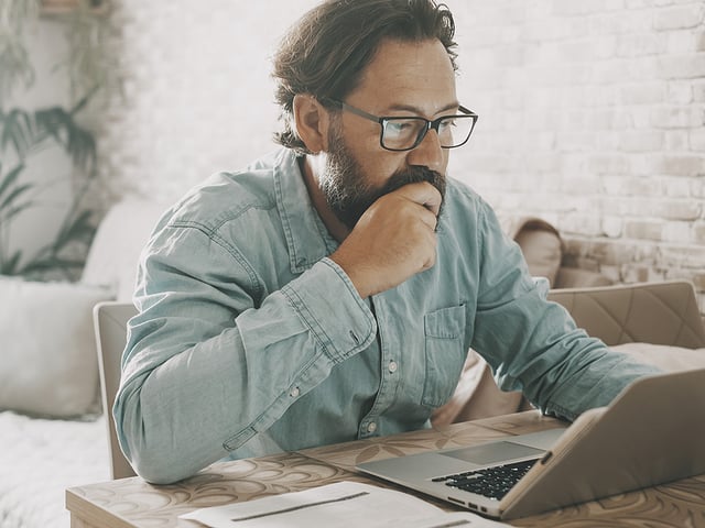bearded man studying laptop.jpg