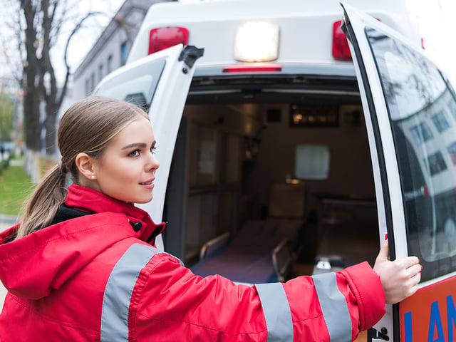female emt shutting ambulance door.jpg
