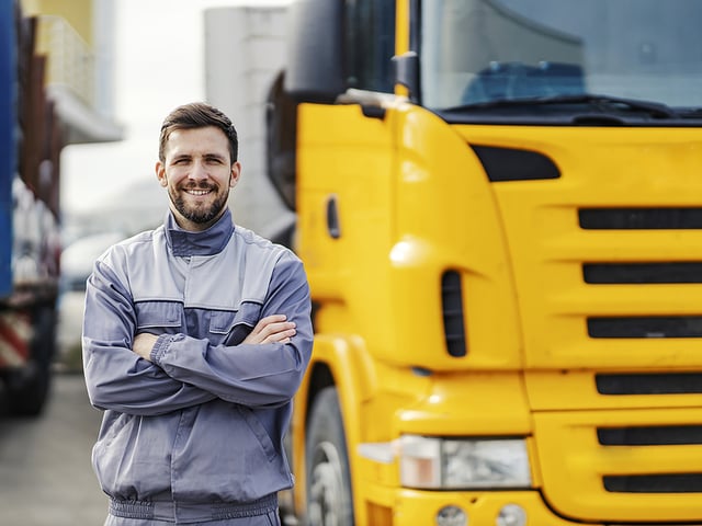 man smiling yellow truck.jpg