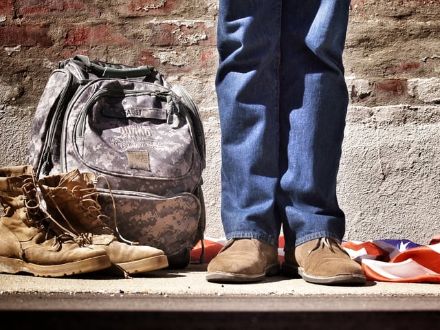 boot jeans next to millitary backpack.jpg