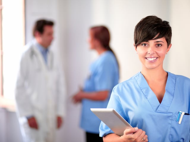 smiling nurse foreground.jpg